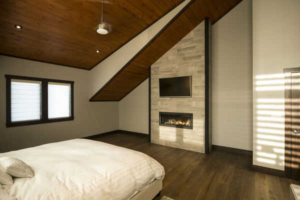Lake-of-Bays-Haven-Ontario-Canadian-Timberframes-Bedroom-fireplace